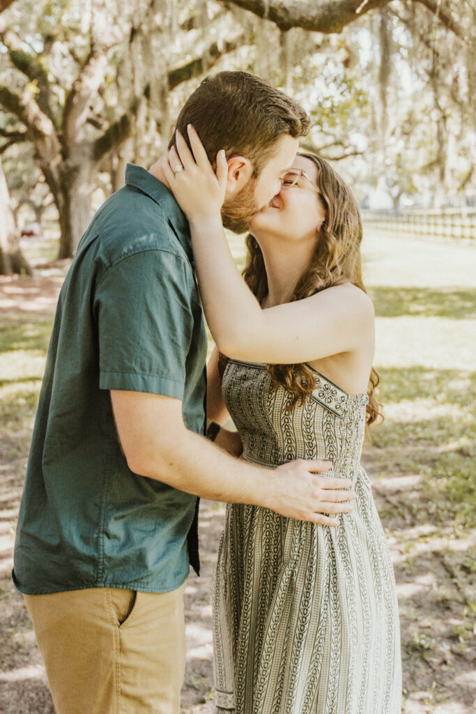 Candid moment during surprise engagement at Boone Hall