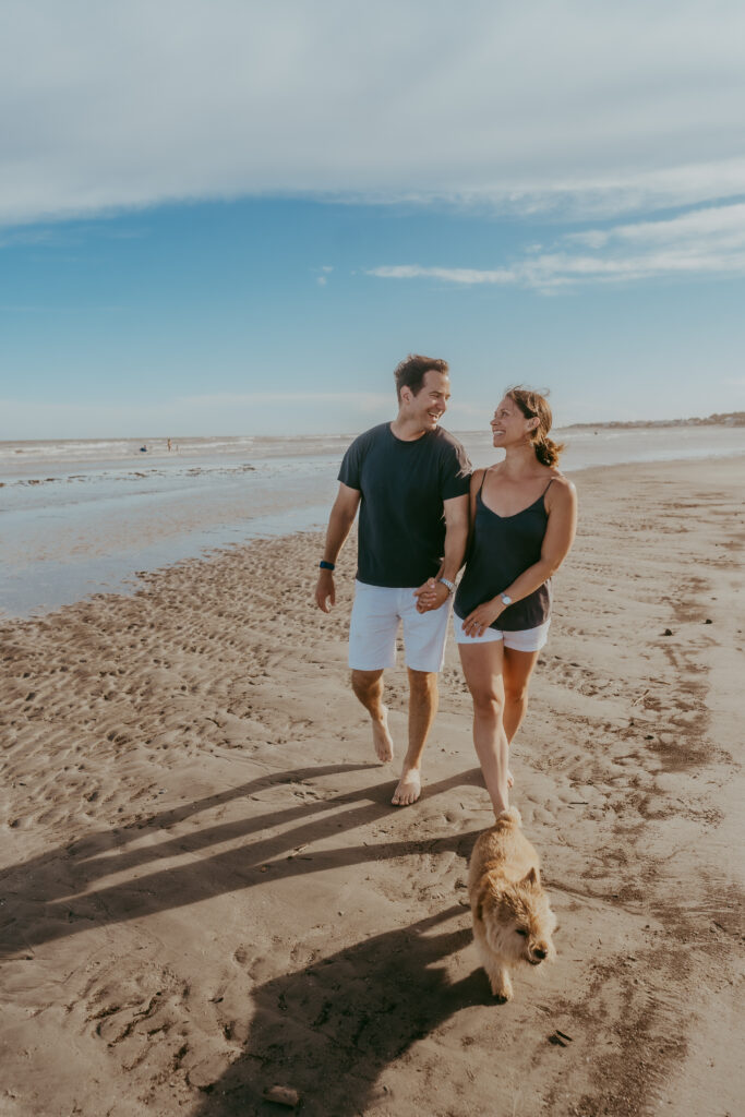 Family standing together during golden hour sunset at Isle of Palms beach SC captured by Moody Momma photographer