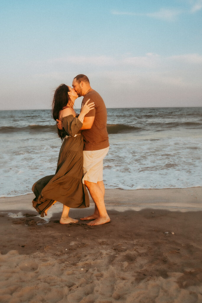 ouple dancing barefoot on Isle of Palms SC beach during sunset photoshoot by Moody Momma photographer