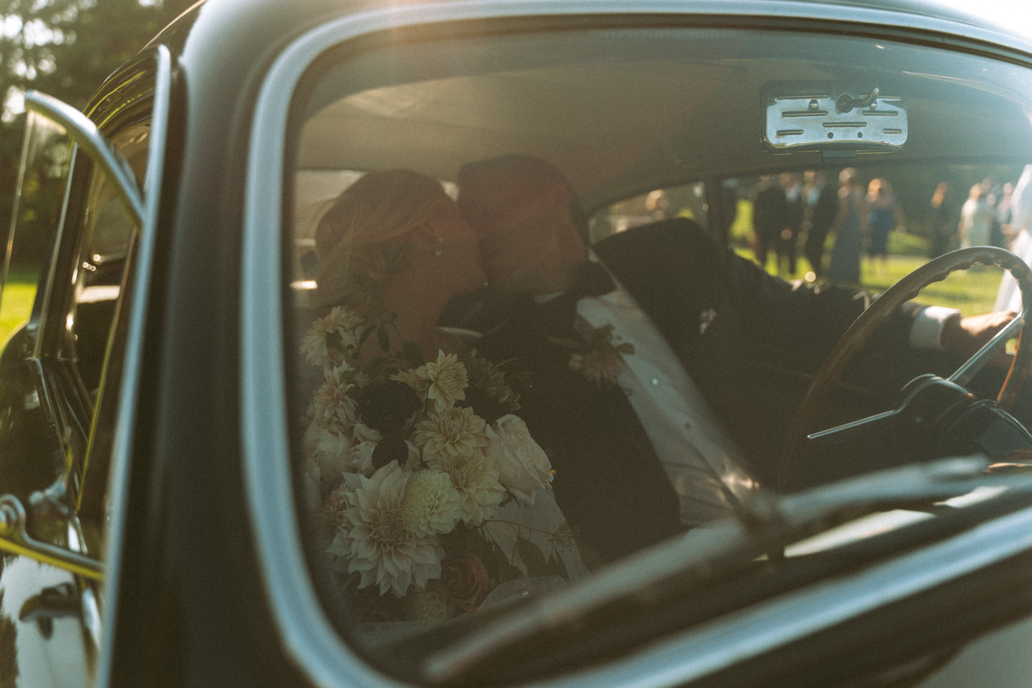 Bridal party laughing together at a Charleston, SC celebration photographed in a cinematic style.