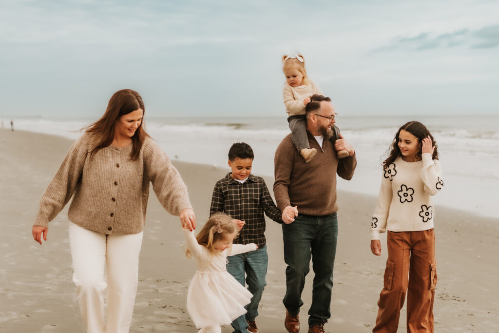 Candid beach family photos in Myrtle Beach with soft coastal colors
